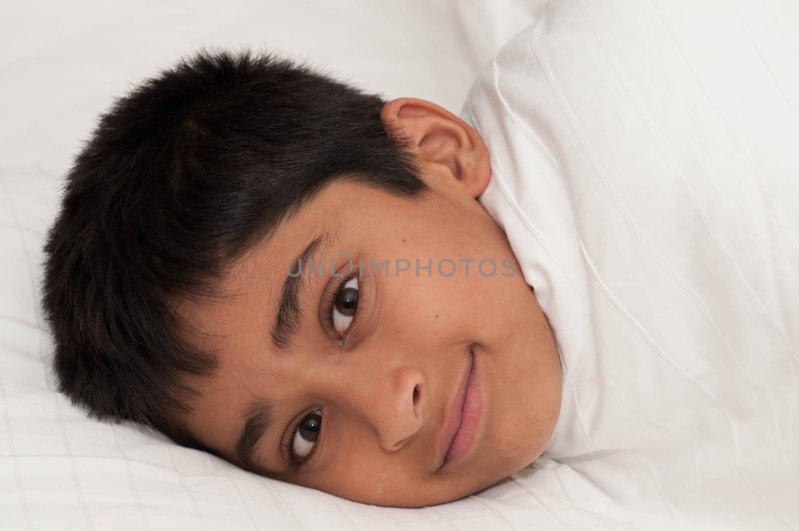 A handsome indian kid smiling for you
