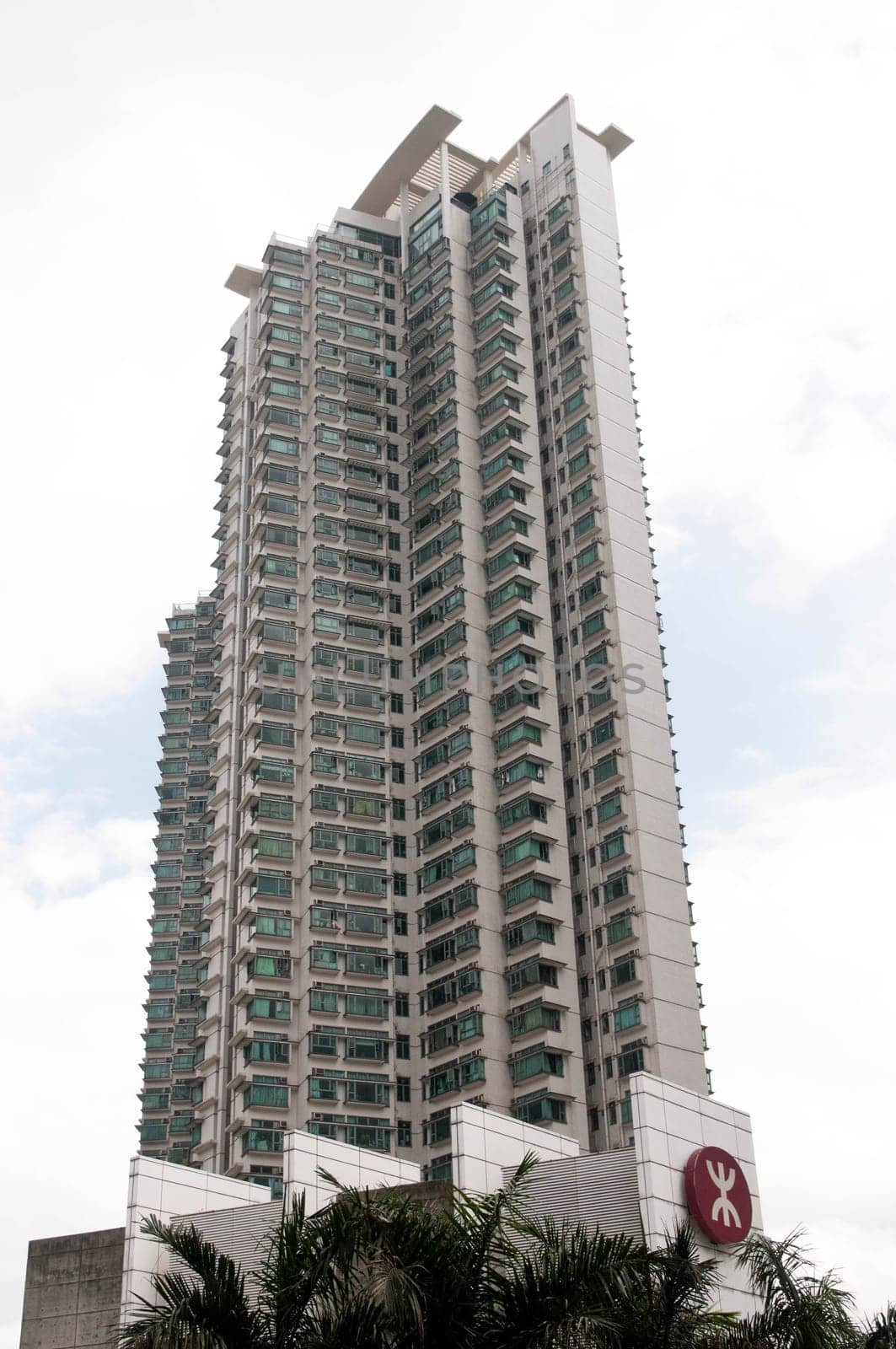 Tall residential apartments touching the blue  sky