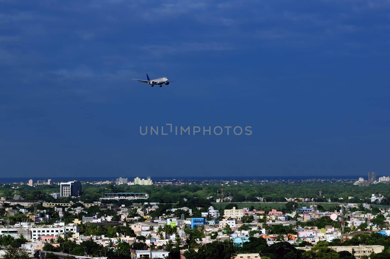 A modern Asian city very densly populated and close to airport