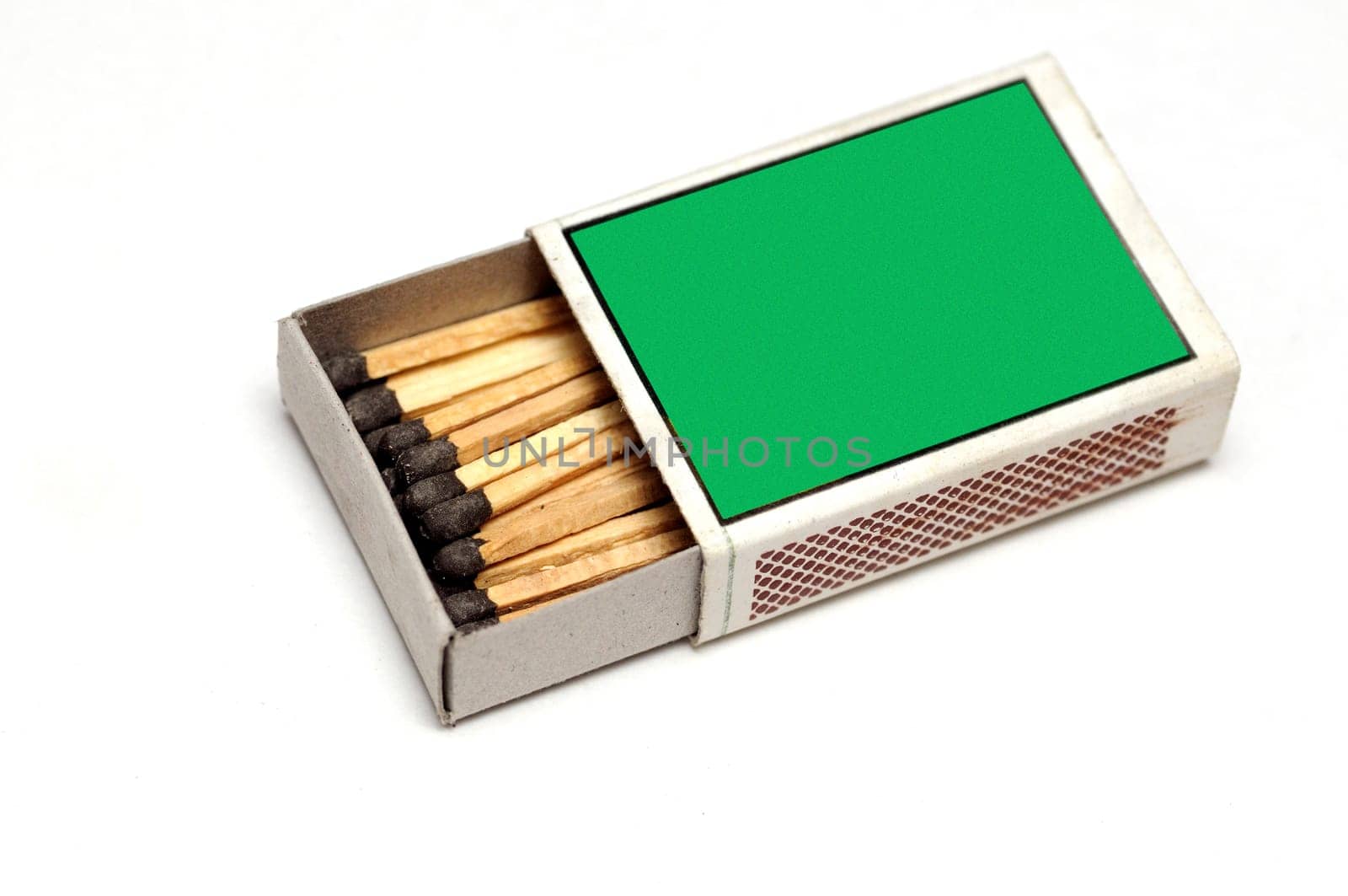 A green matchbox isolated on a white background