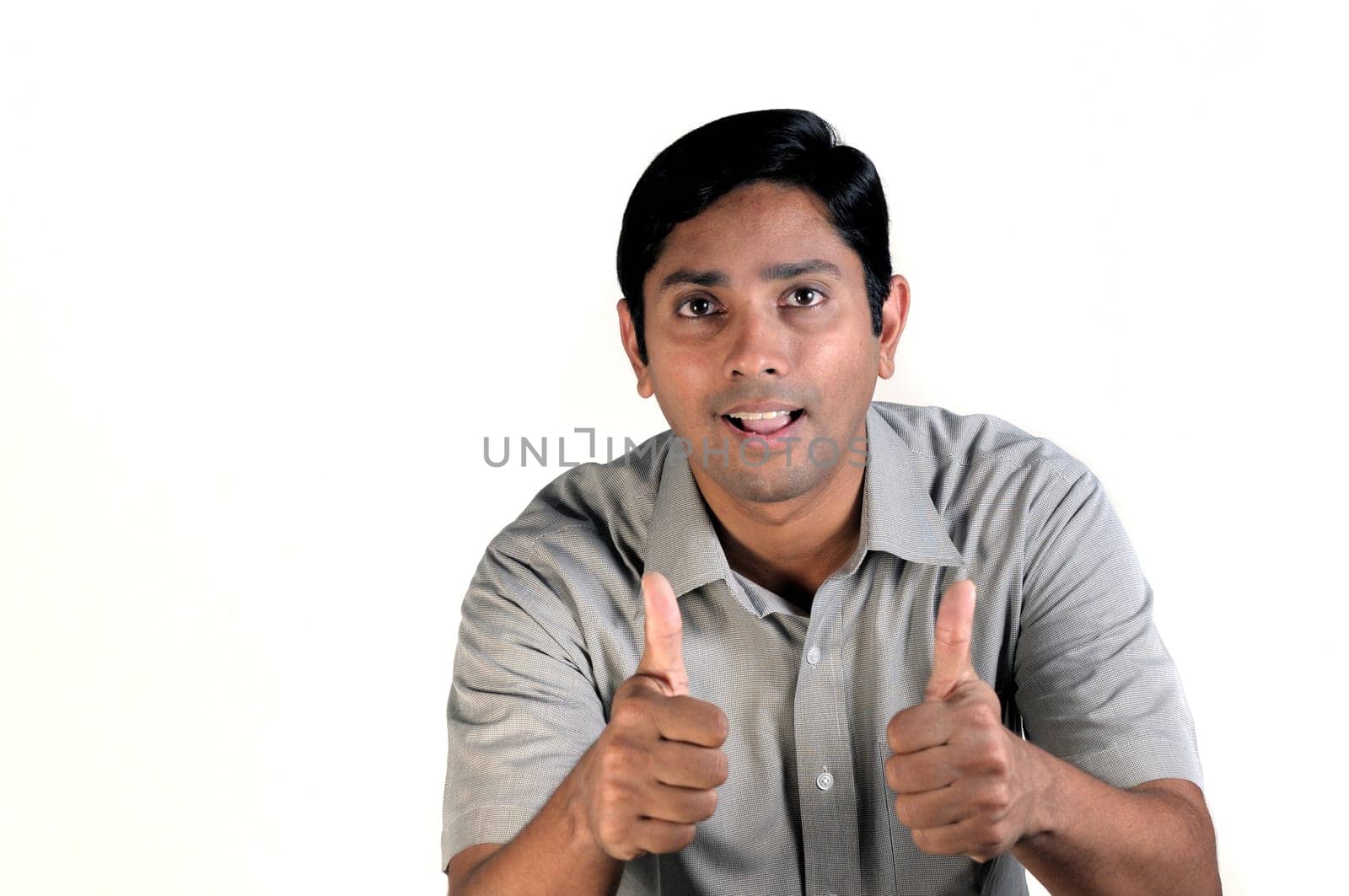 An handsome indian man looking very excited