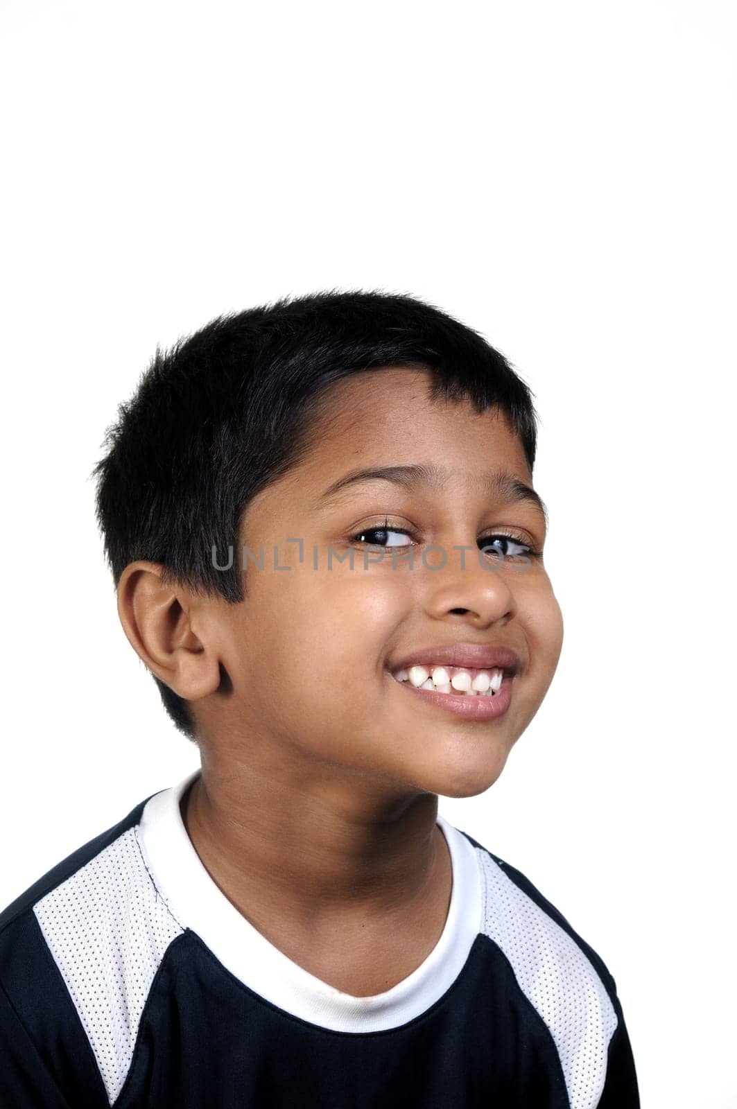 an handsome young indian kid thinking about something