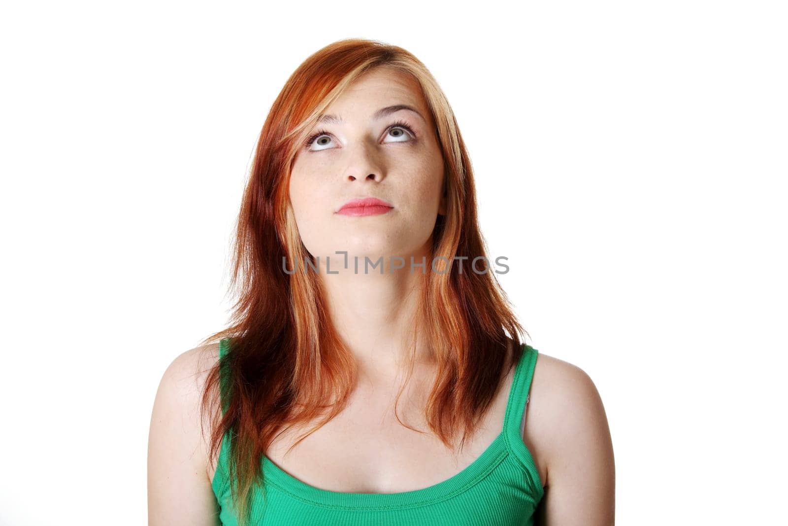 Teen pretty caucasian student looking up. Isolated on white.