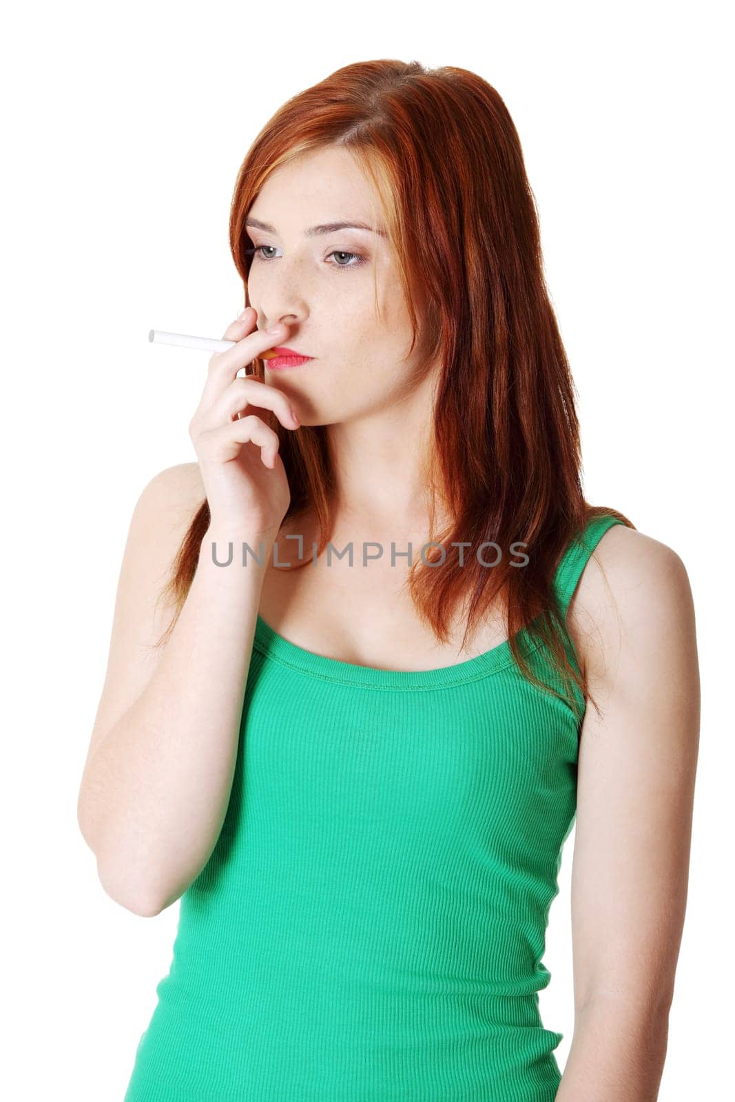 Pretty standing teen caucasian smoking girl. Isolated on white background.