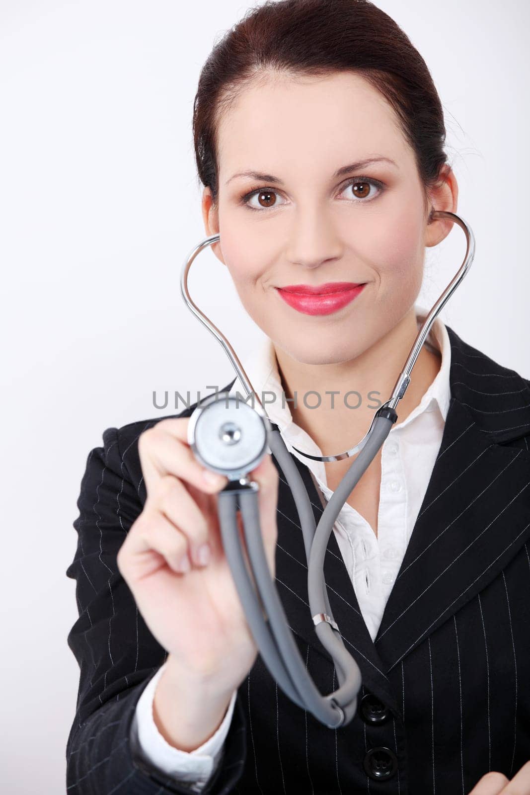 Pretty caucasian woman with stethoscope. Isolated on white background.