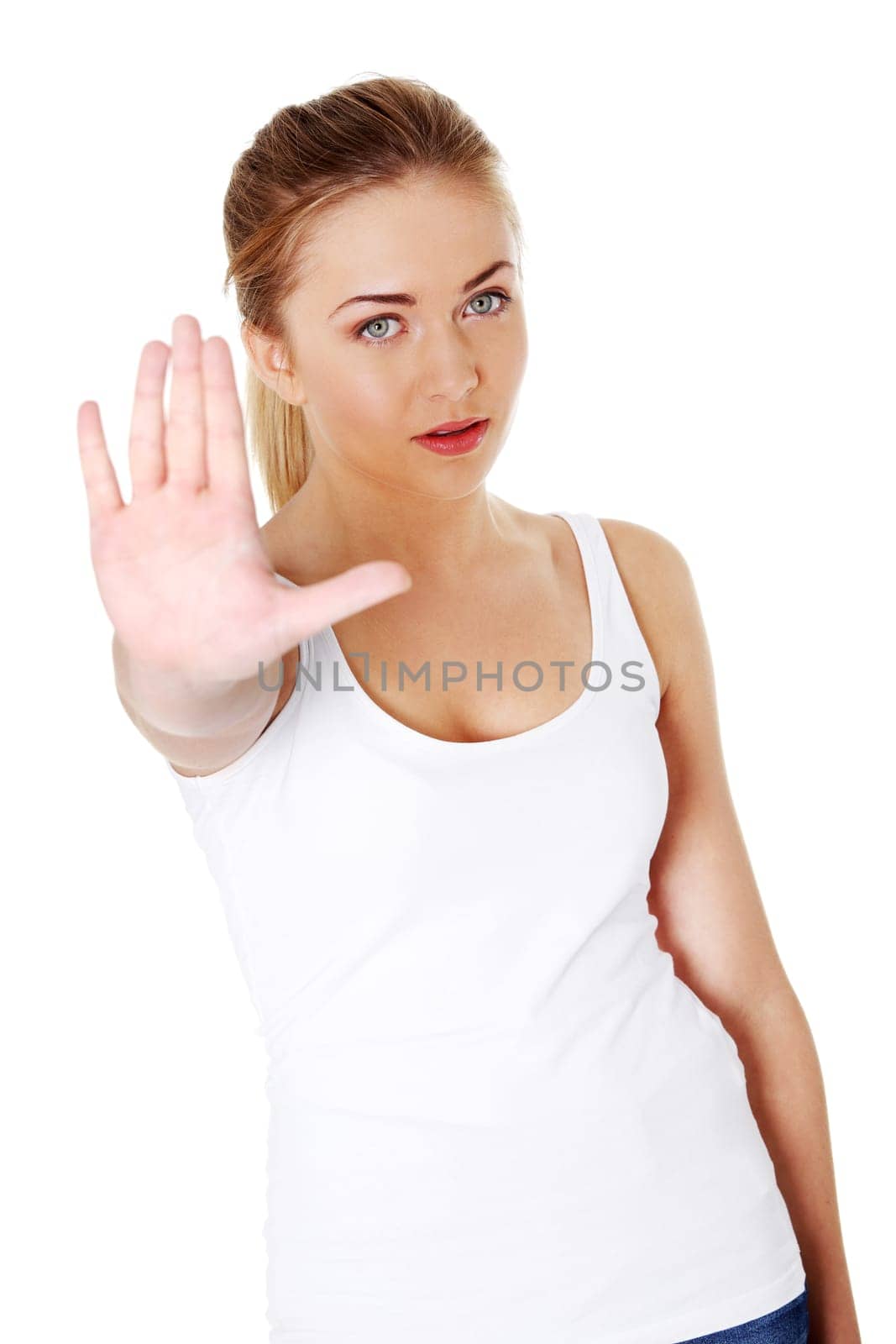 Bright picture of young woman making stop gesture.