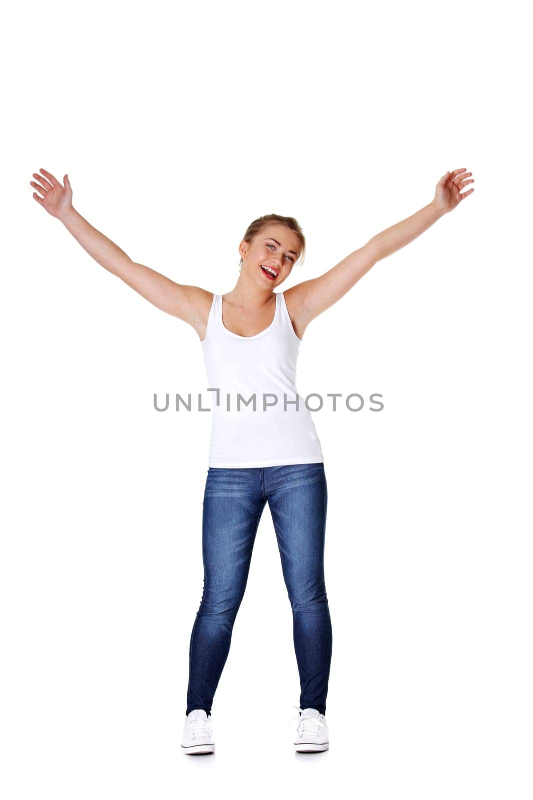 Happy attractive teen girl with her hands up