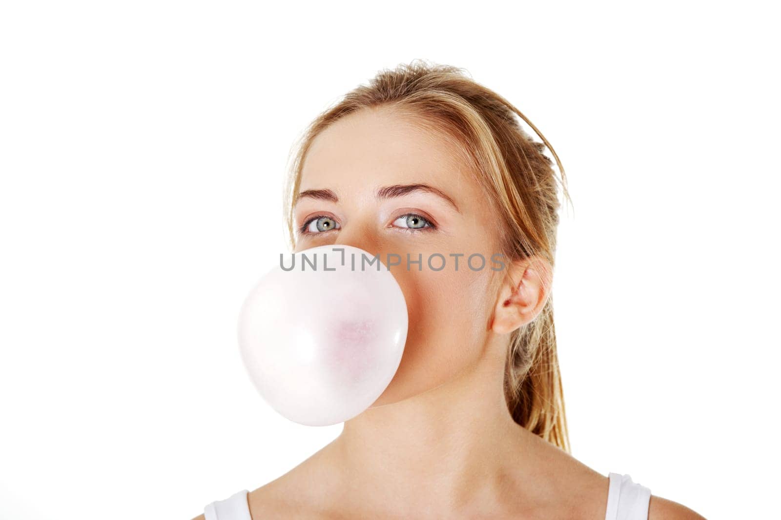 Young beautiful woman blowing bubble gum