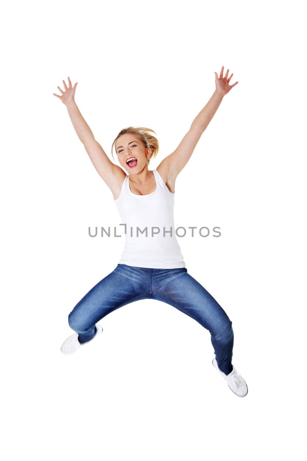 Young happy caucasian woman jumping in the air , isolated on white background