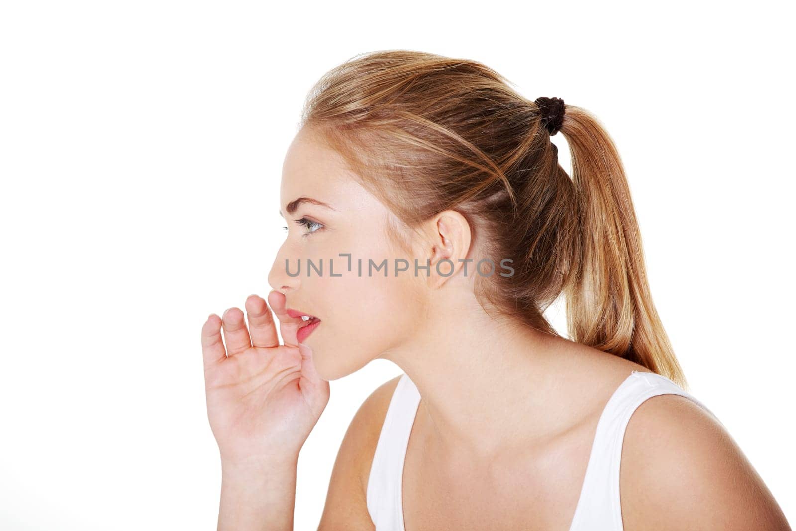 Teen woman whispering gossip to somebody