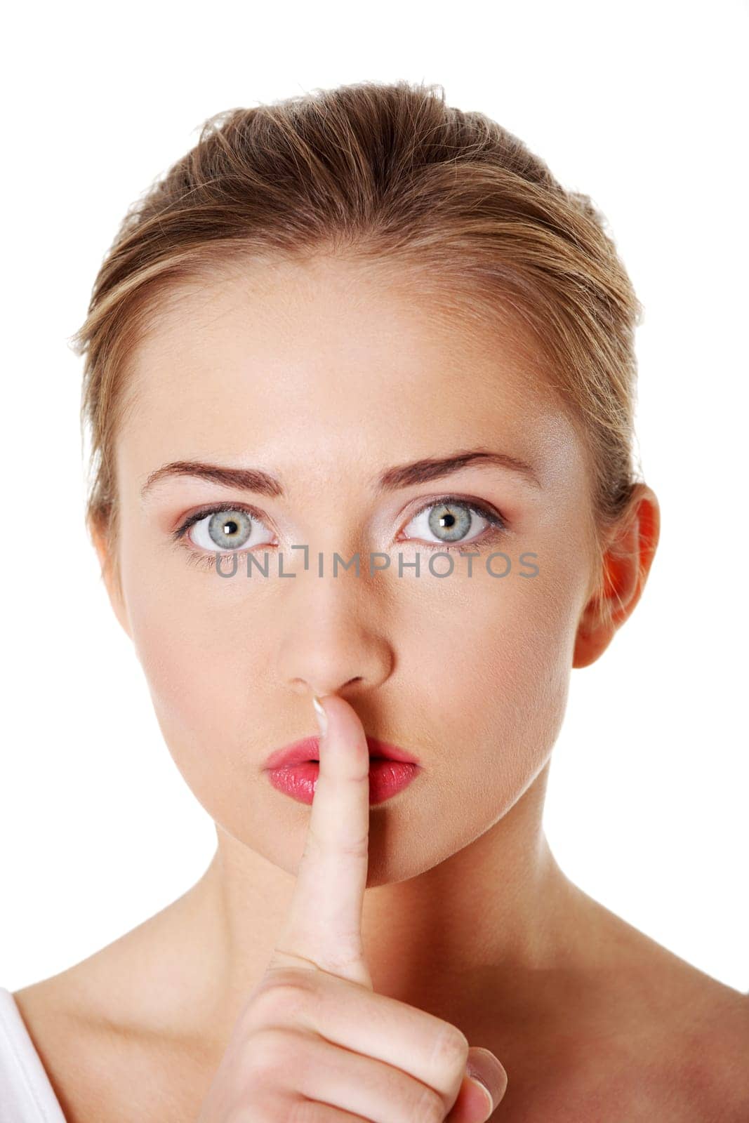 Woman making a keep it quiet gesture