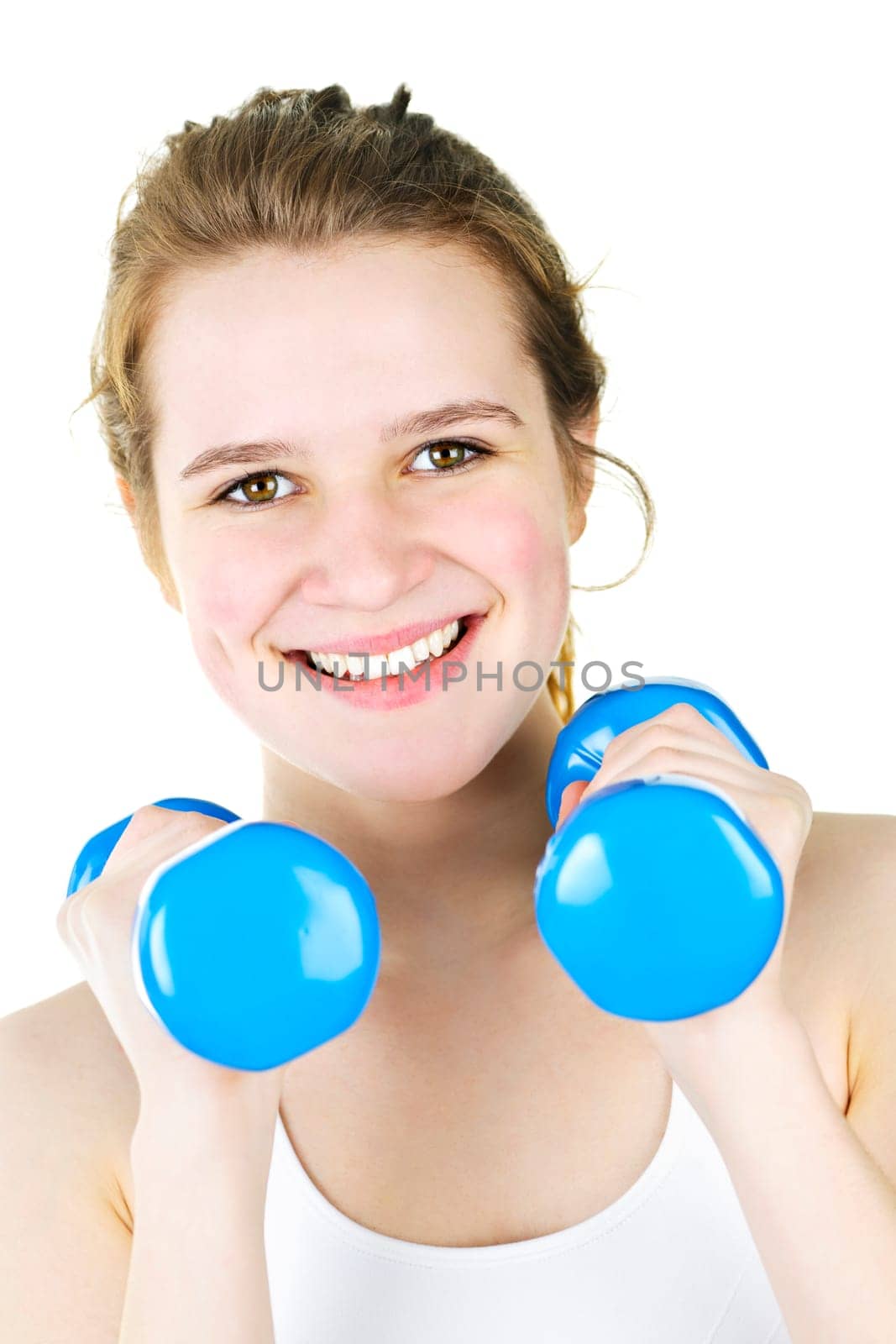 Portrait of smiling fit young woman working out with weights for fitness exercise
