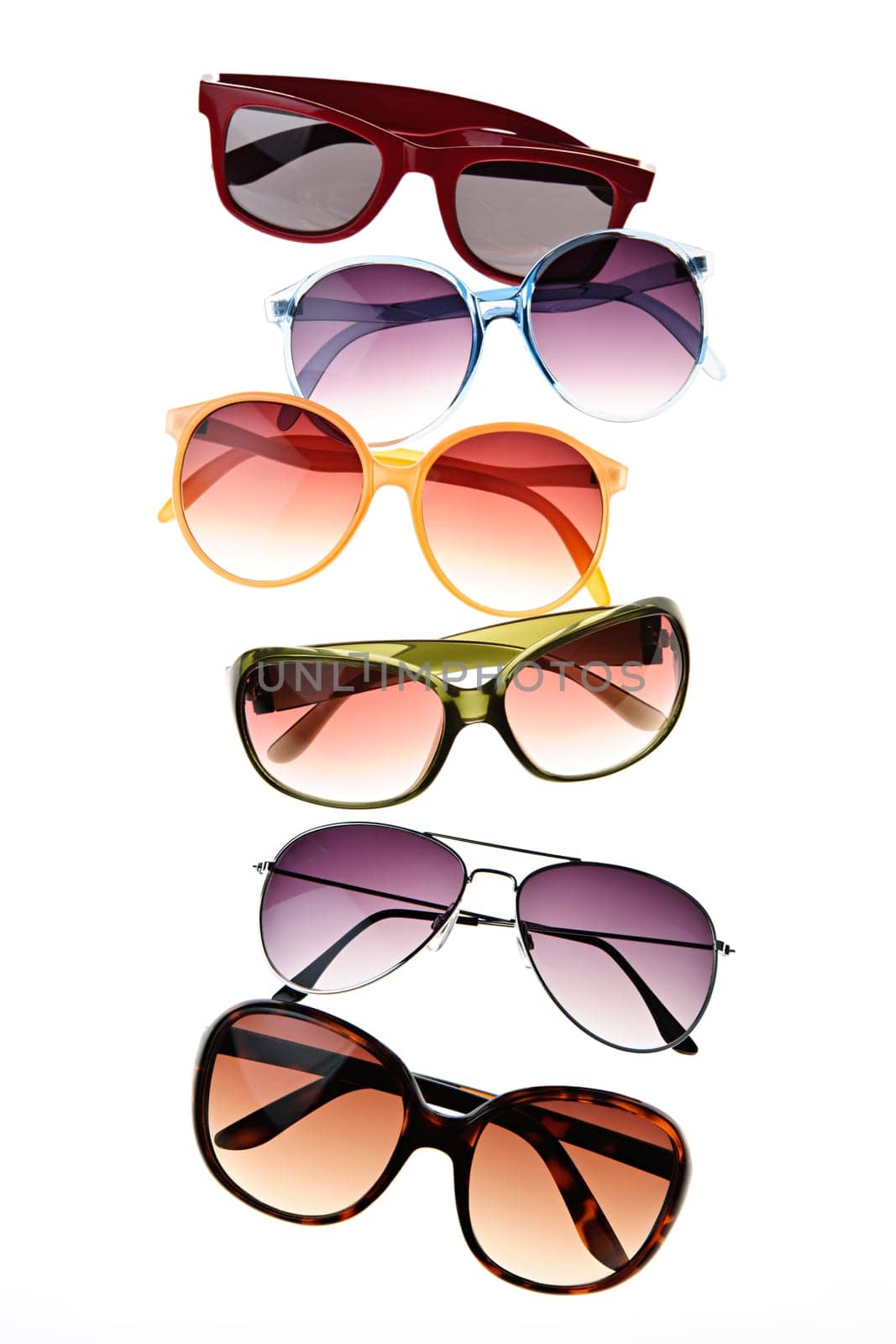Assorted styles of tinted sunglasses isolated on white background