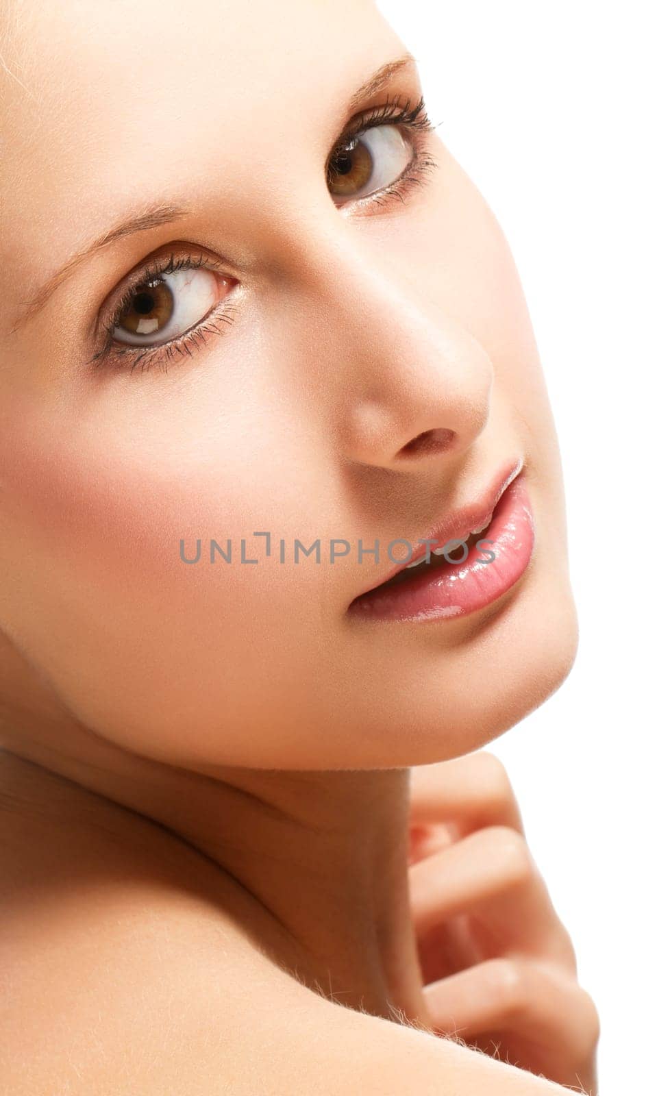 Portrait of a young beautiful blonde woman on a white background