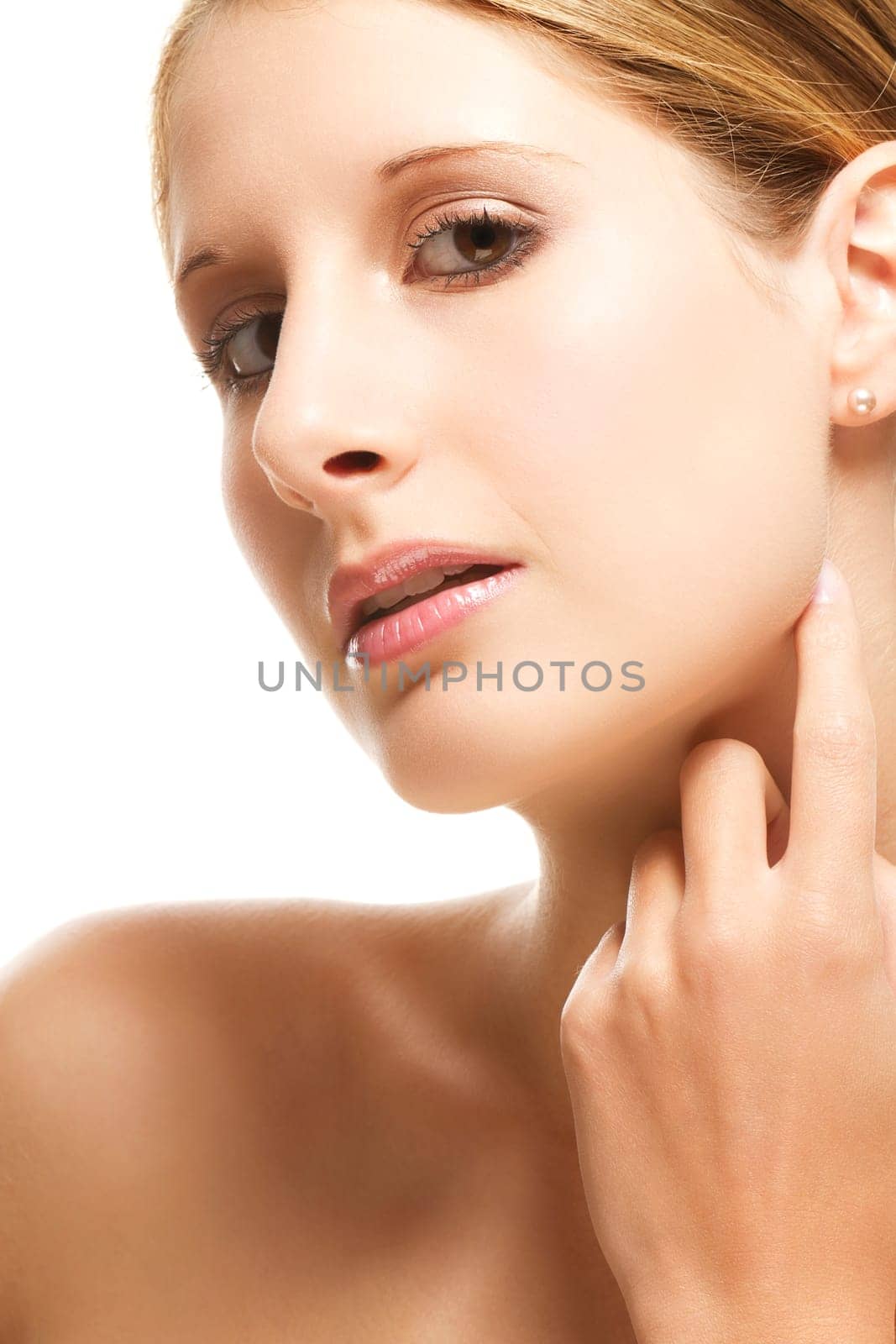 Young beautiful woman holding hand to her face on white background