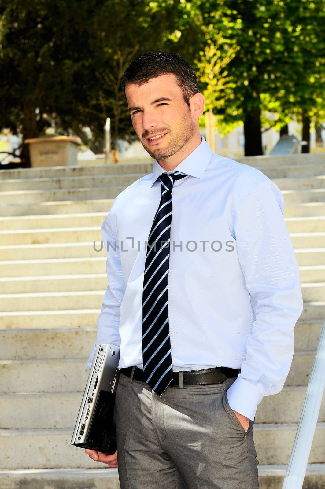 busy businessman outdoor with his computer