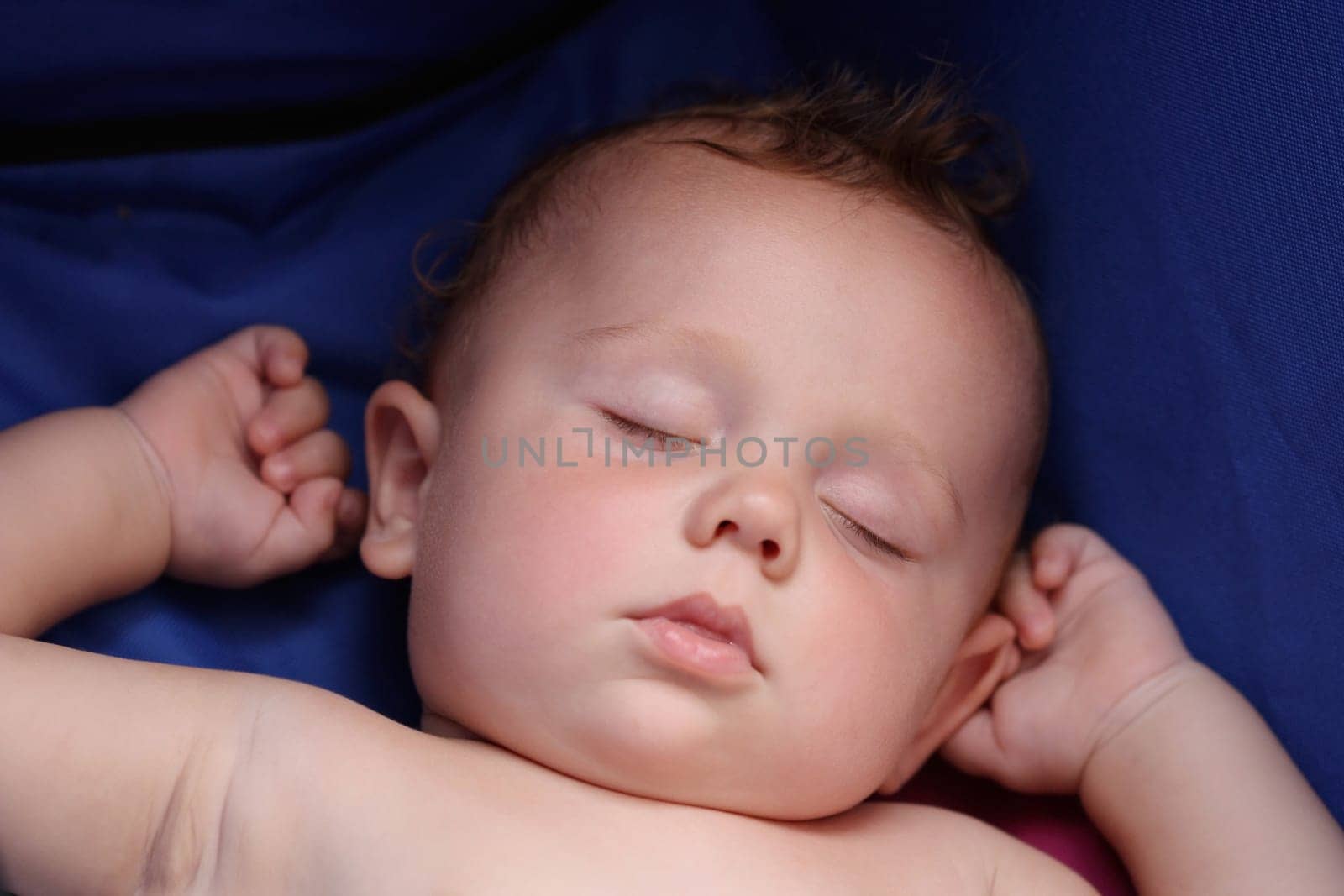 sweet little boy sleeps in a stroller