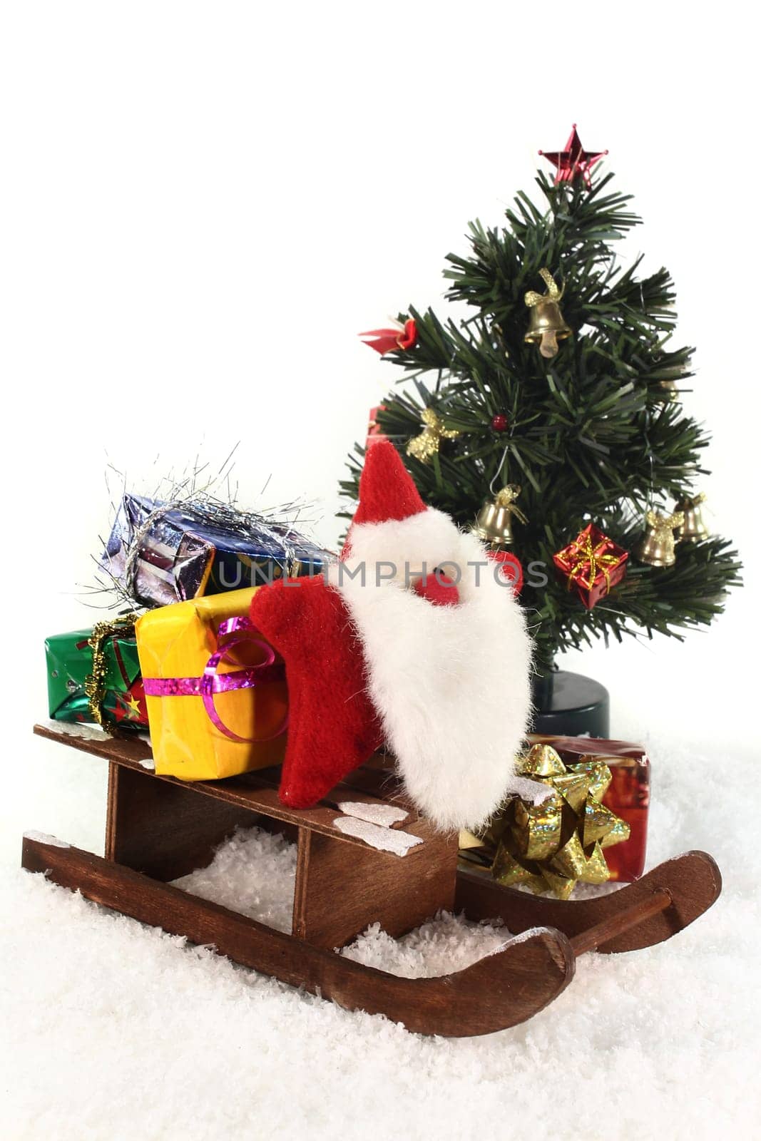 a sleigh with colorful gifts in the snow