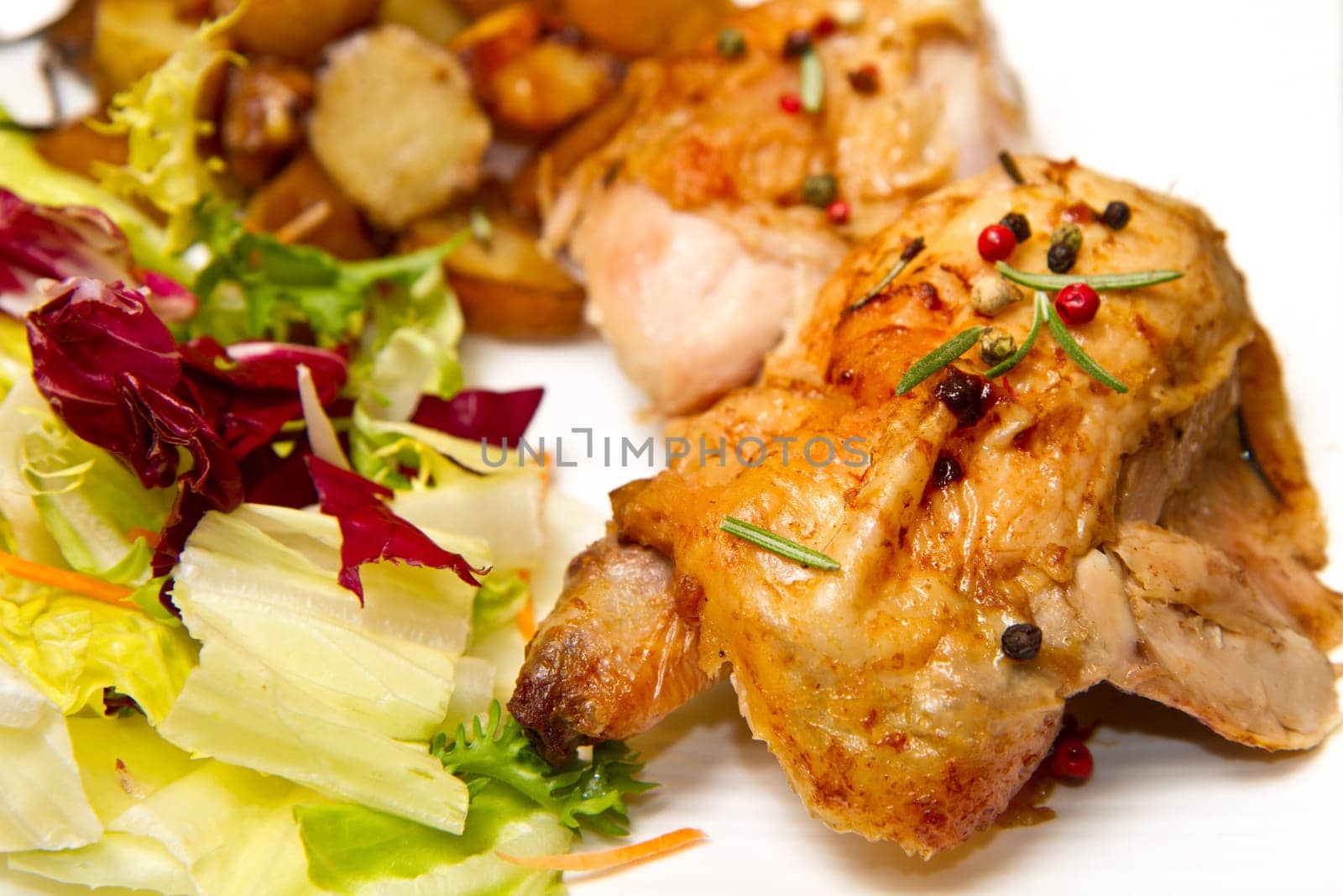 Roast chicken with salad and potatoes