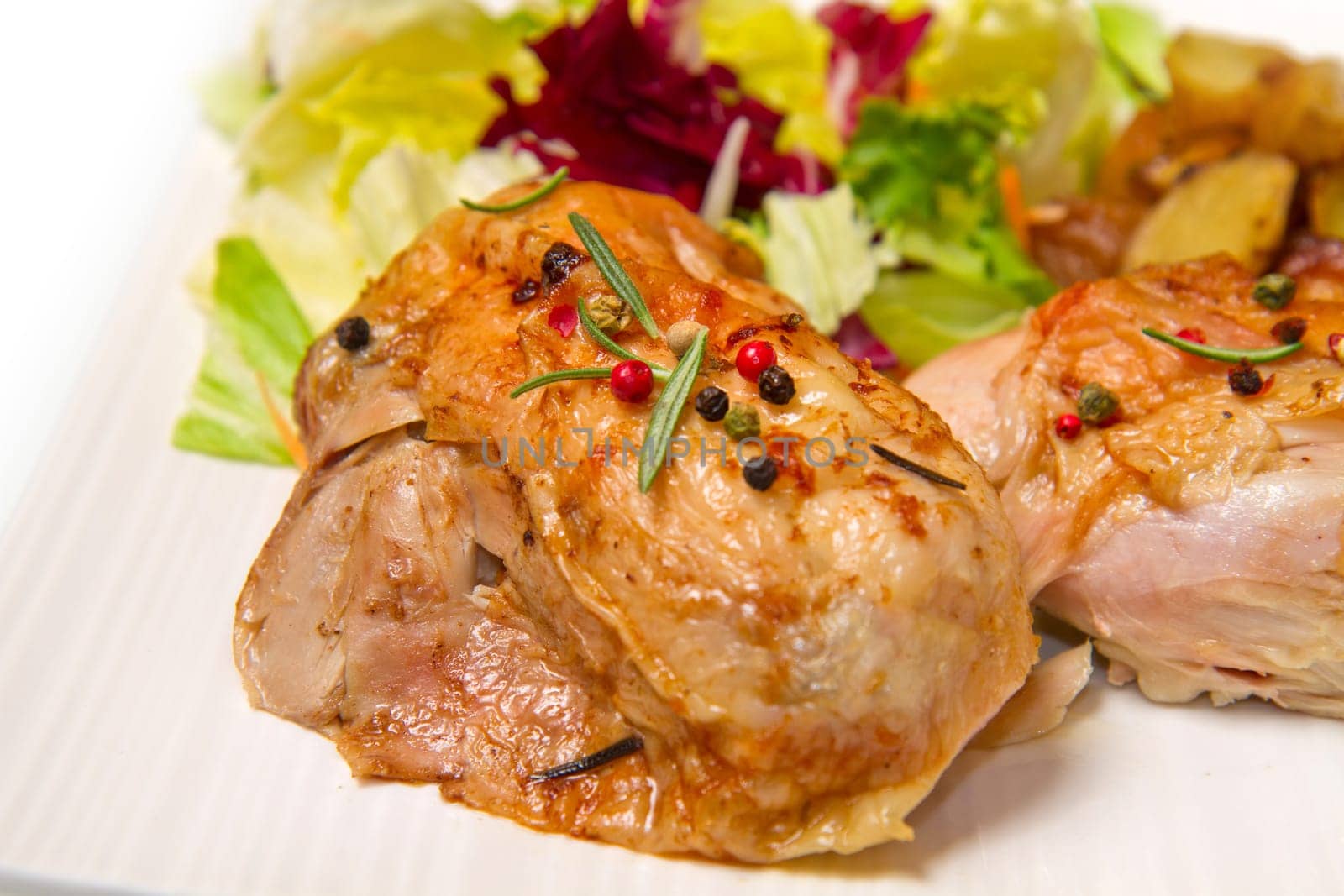 Roast chicken with salad and potatoes