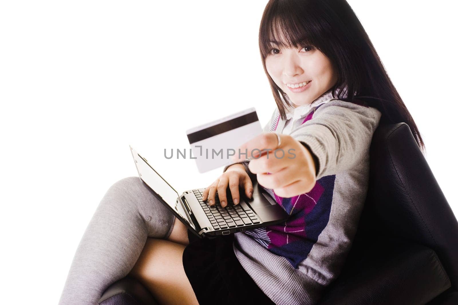 Chinese school girl holding up a credit card.