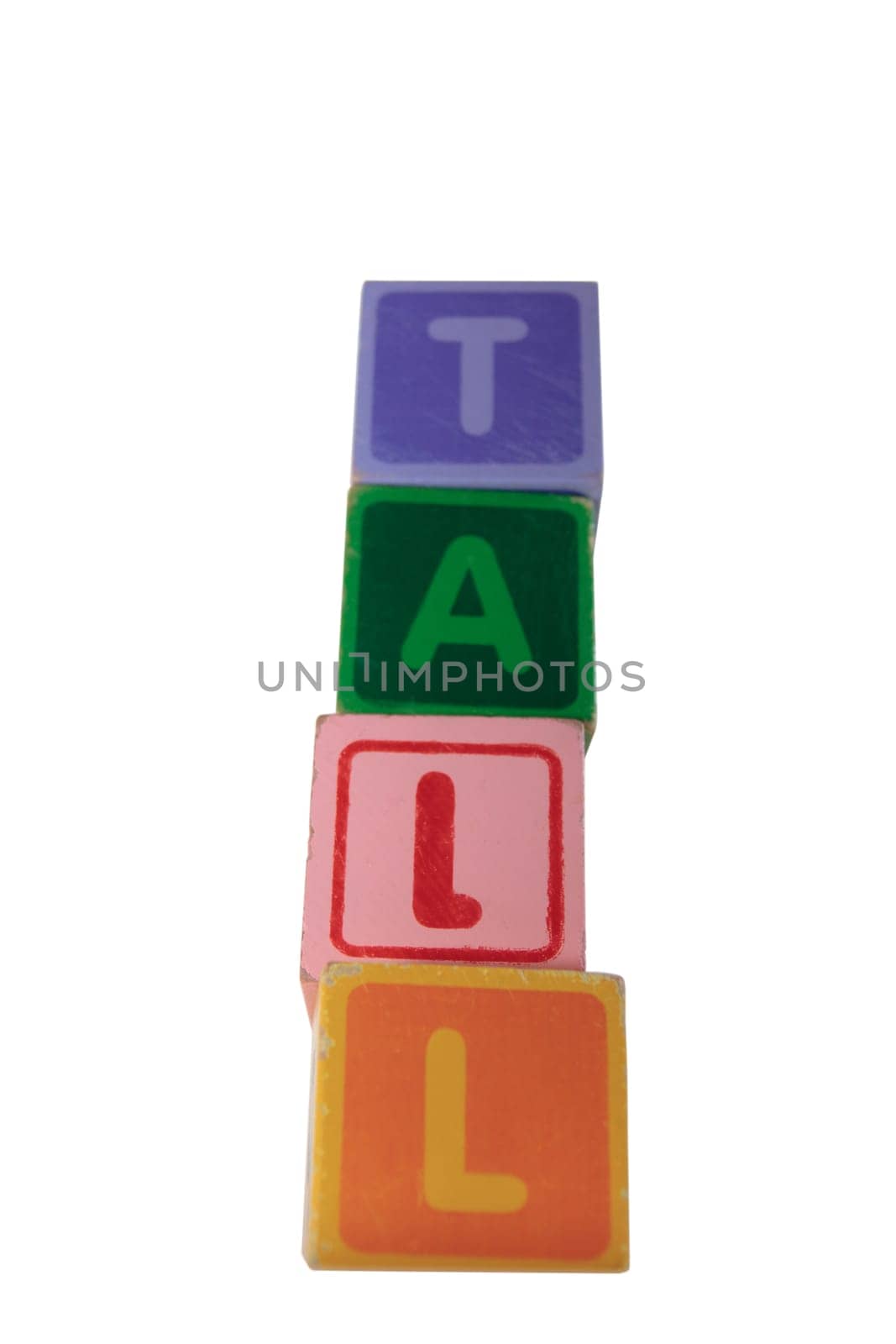 childrens toy letter building blocks against a white background spelling tall with clipping path