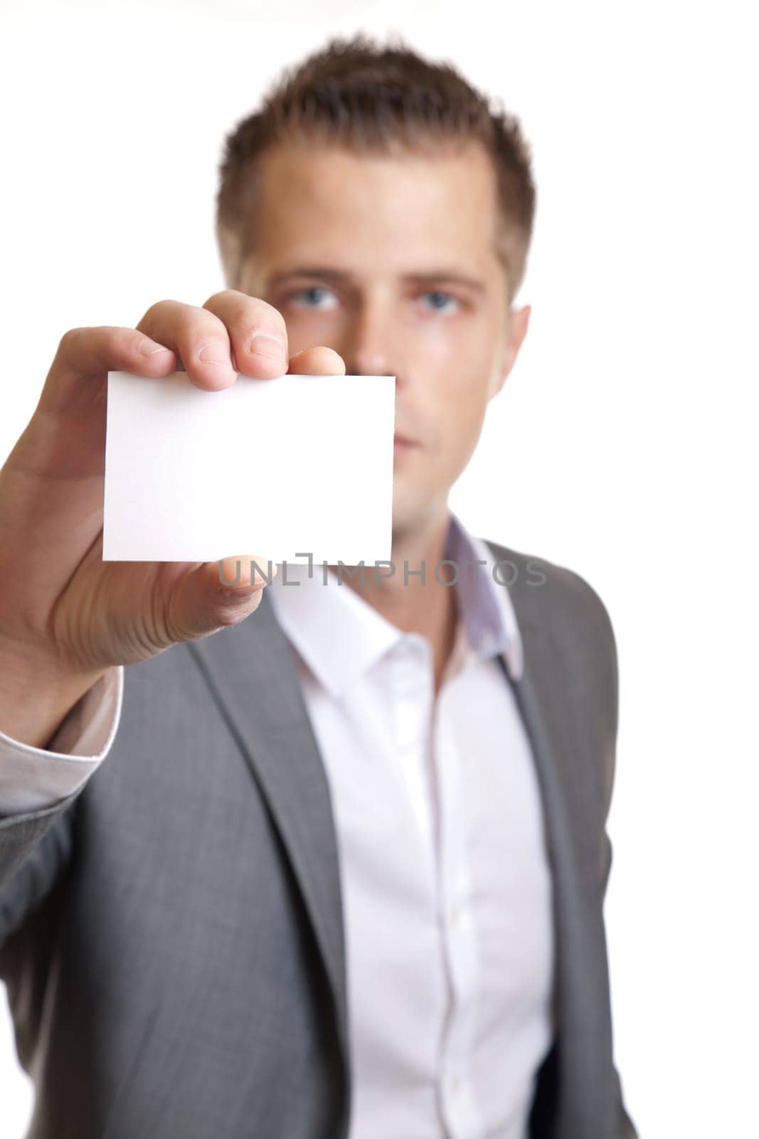 Young businessman showing an empty business card