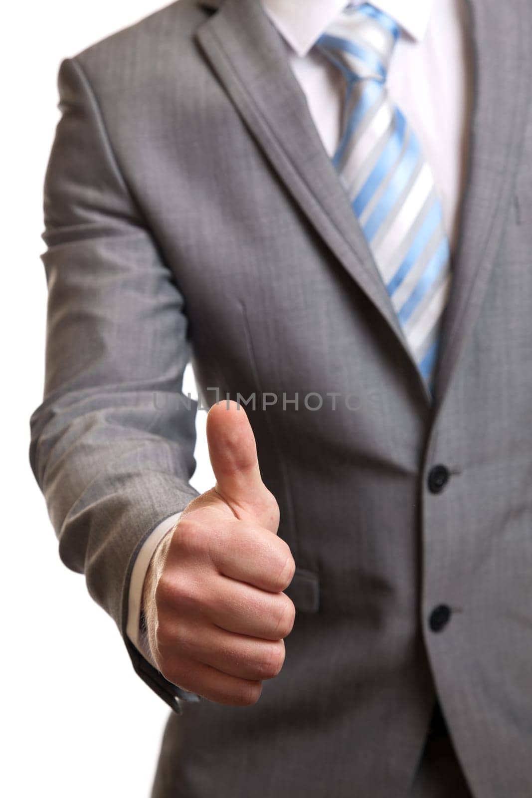 Businessman in suit giving thumbs-up sign