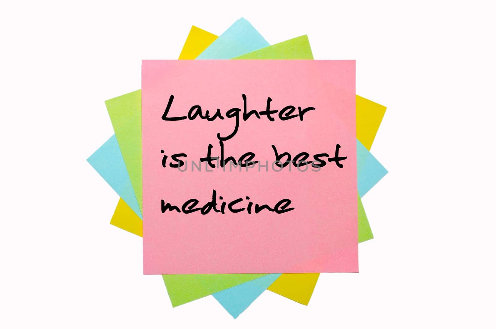 text "Laughter is the best medicine"" written by hand font on bunch of colored sticky notes"