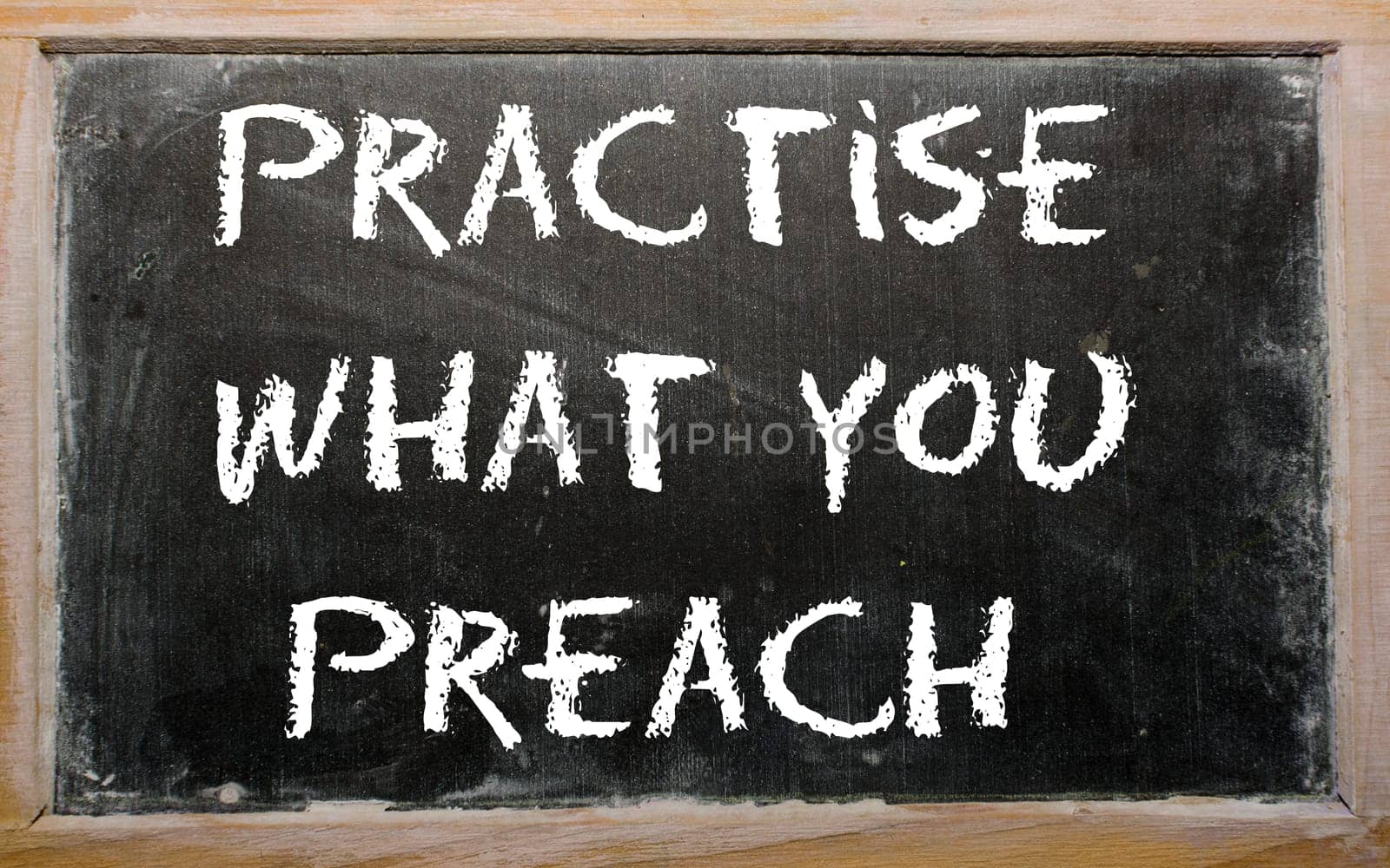 Blackboard writings "Practise what you preach"""