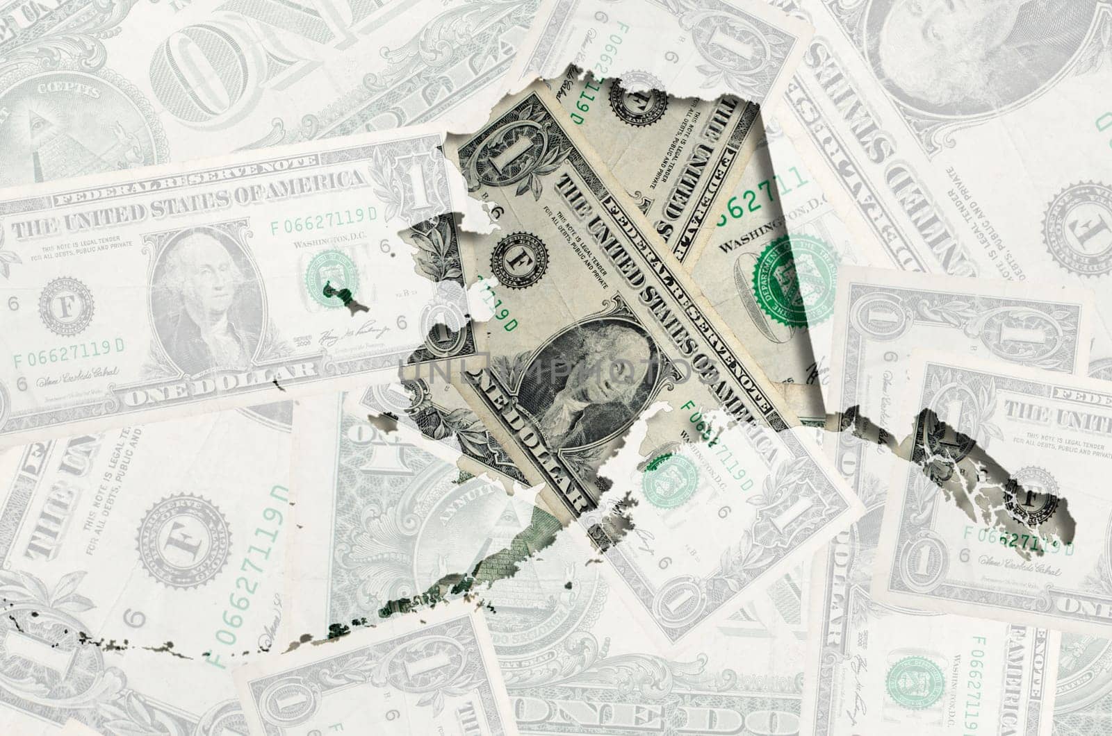 Outlined alaskan map of  with transparent background of US dollar banknotes