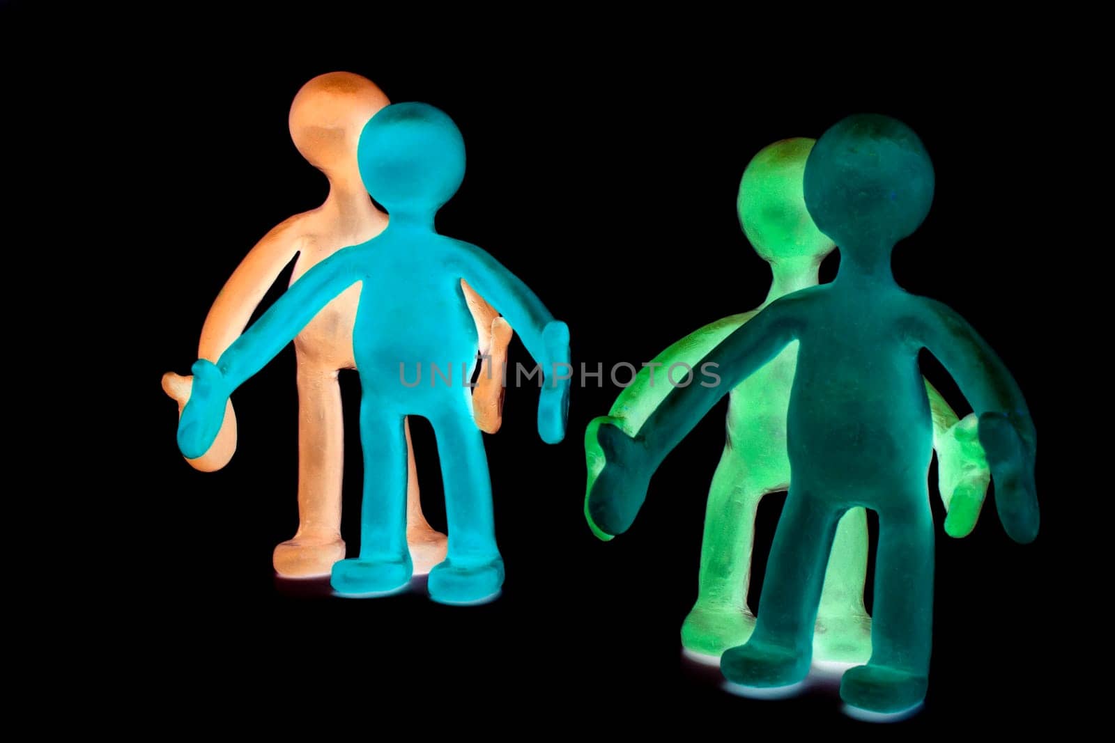 Shaded plasticine puppets pair standing near each other