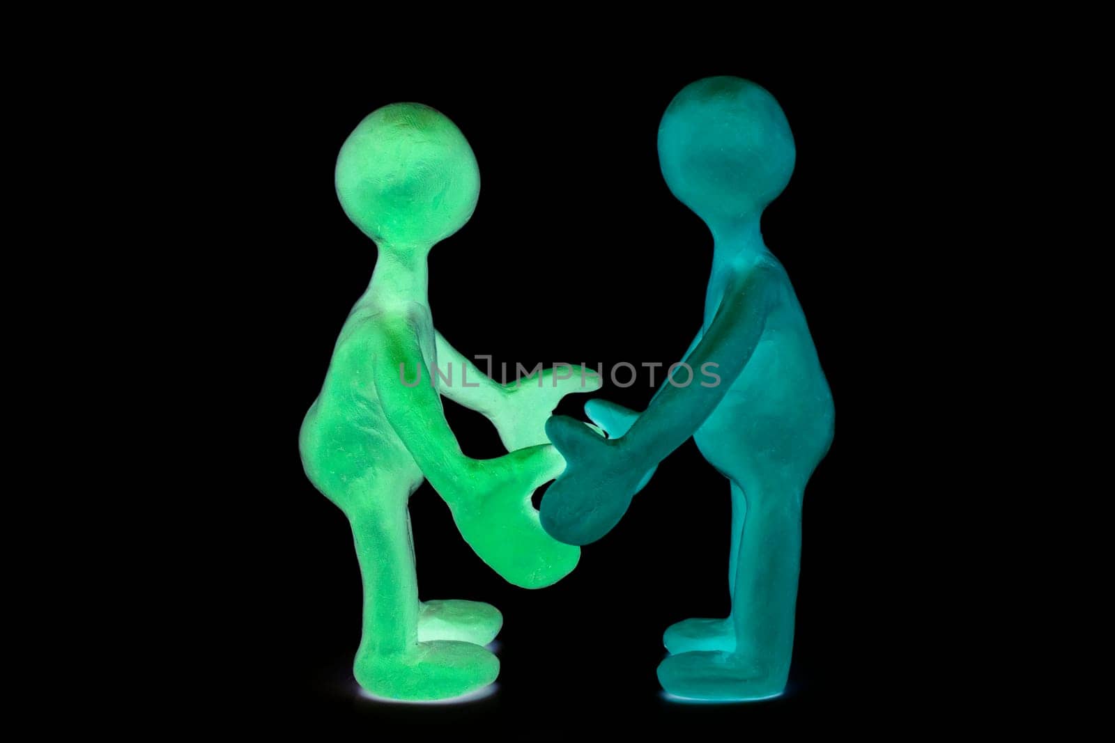 Two shaded plasticine puppets standing opposite each other