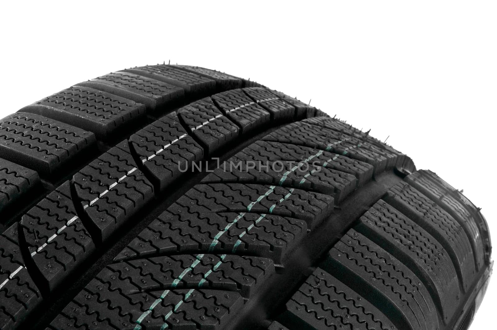 Winter tire close up on white background.