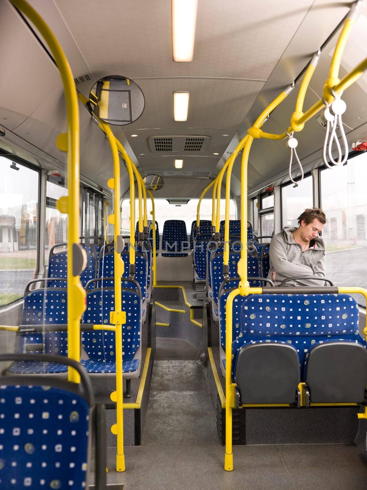 Young man sleeping on the bus