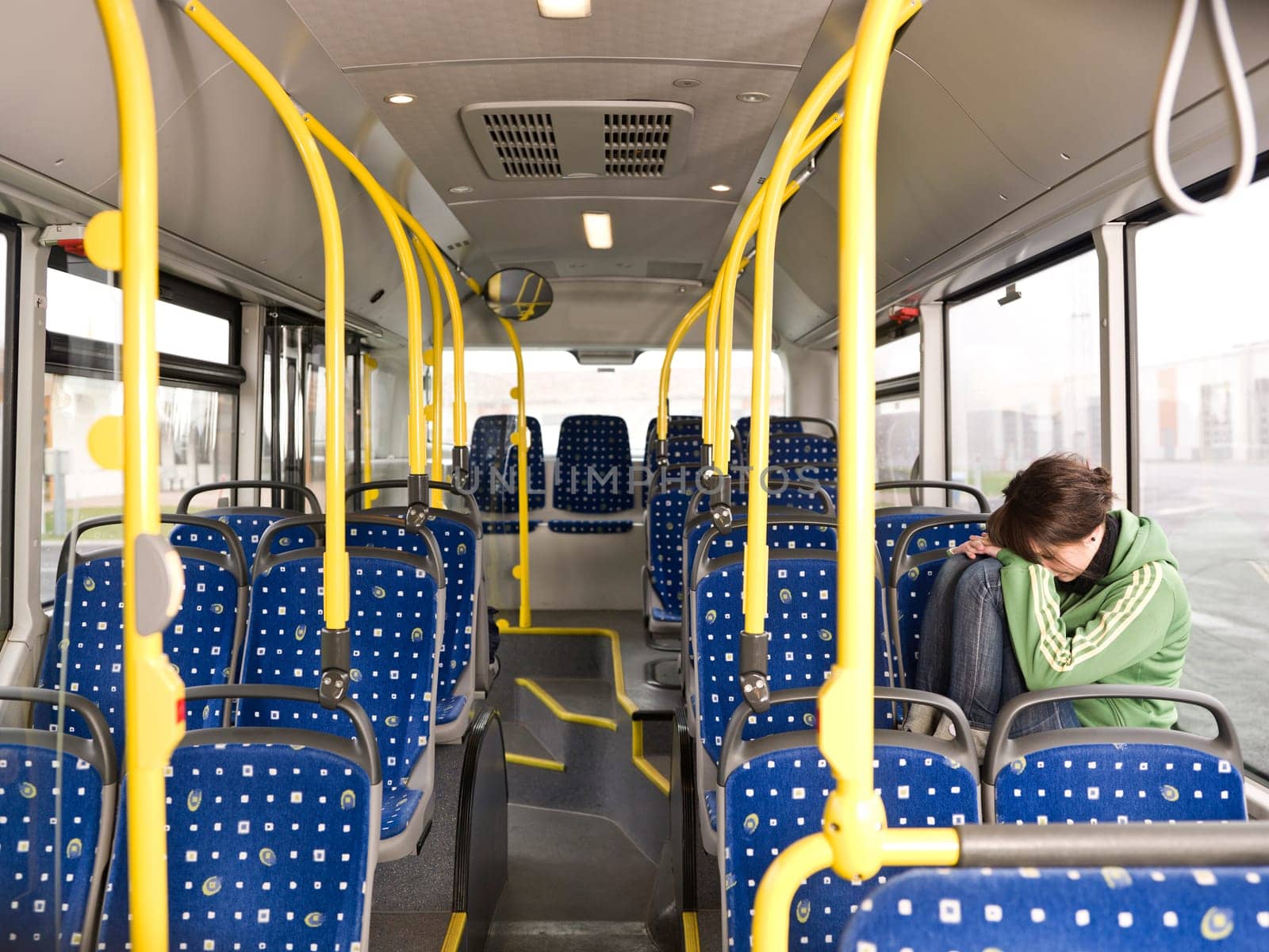 Sad woman alone on the bus