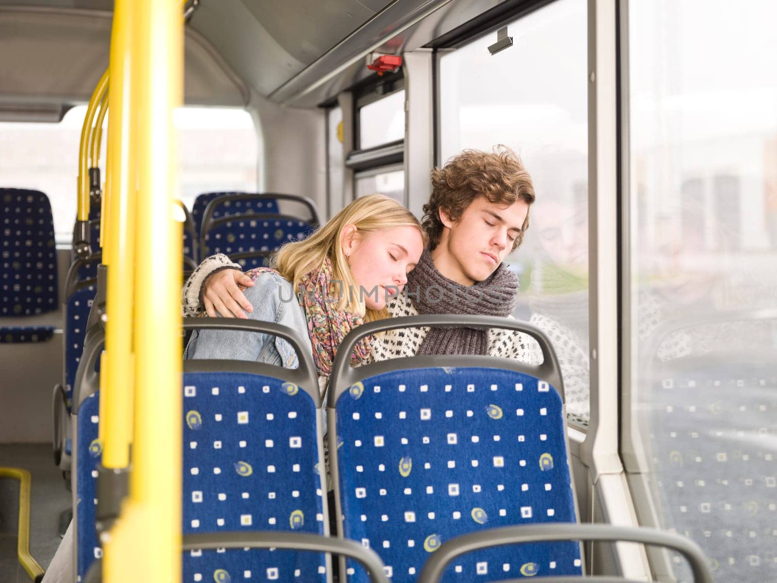Young couple sleeps on the bus