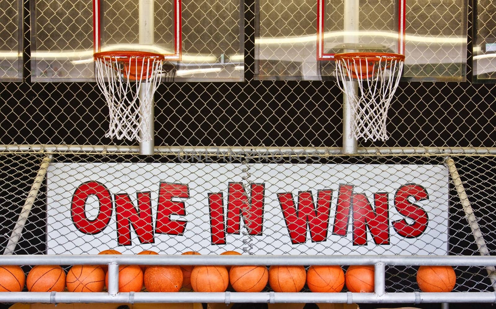 A basketball game of chance on a boardwalk