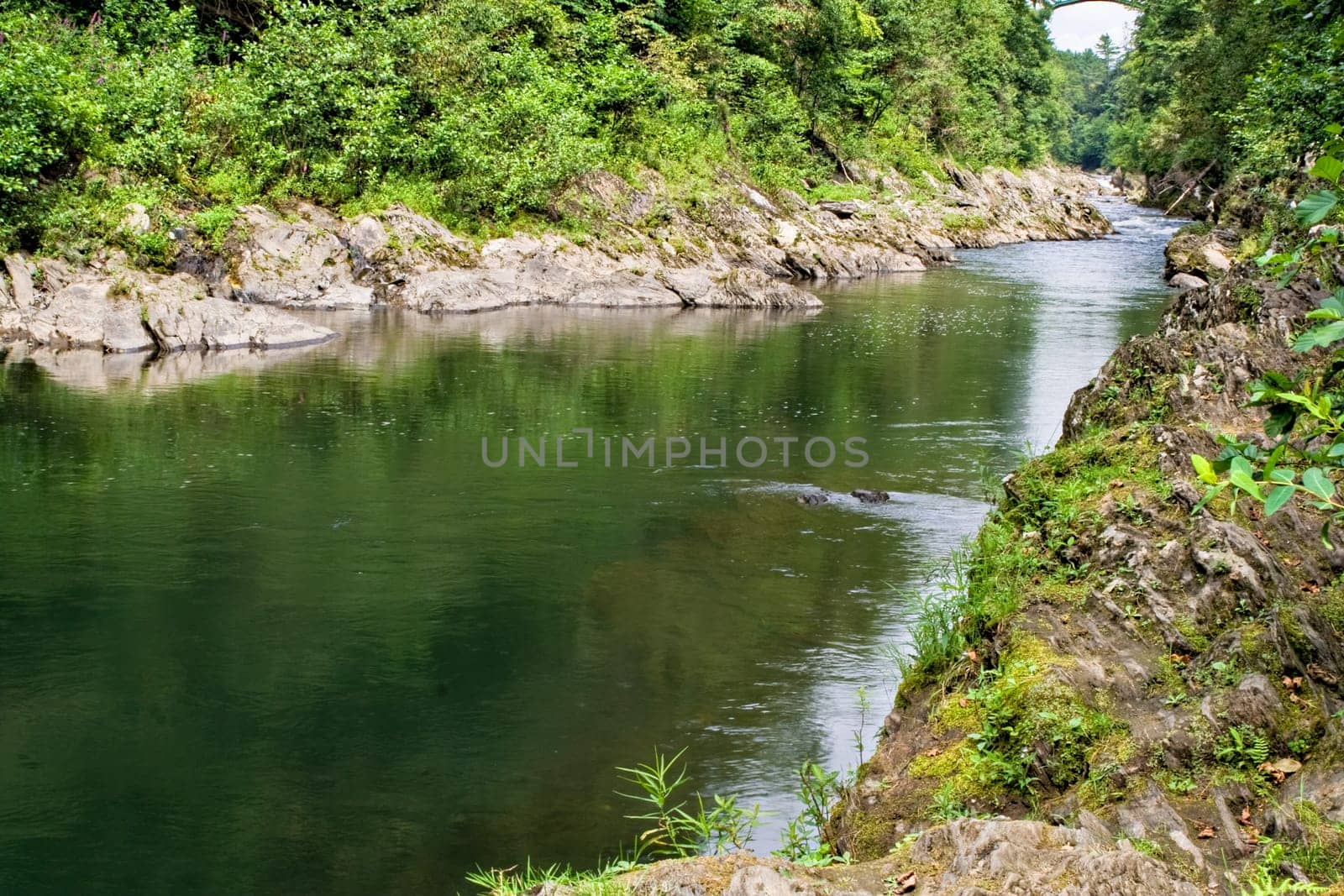 This is the bottom of Quechee Gorge in Quechee, Vermont. The river flowing through this gorge is the Ottauquechee River.