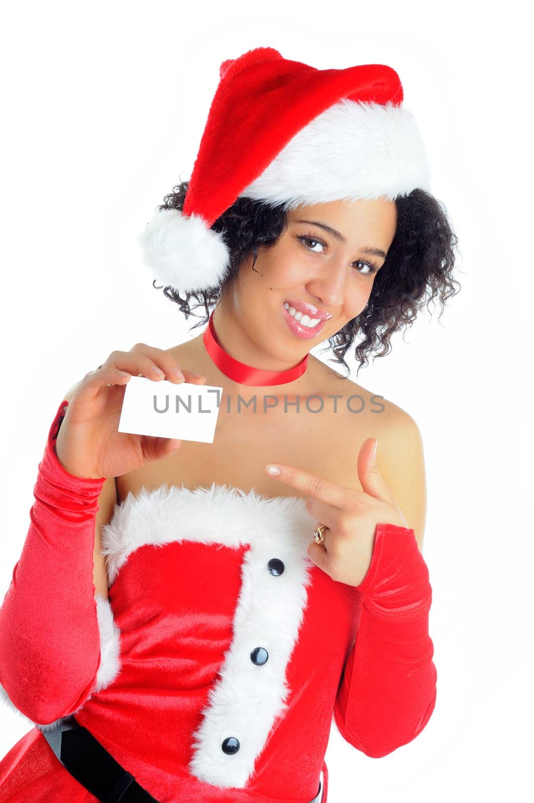 Beautiful African American Young Woman Standing Holding A Blank Sign For Your Message Dressed In A Sexy Santa Costume Isolated On A White Background