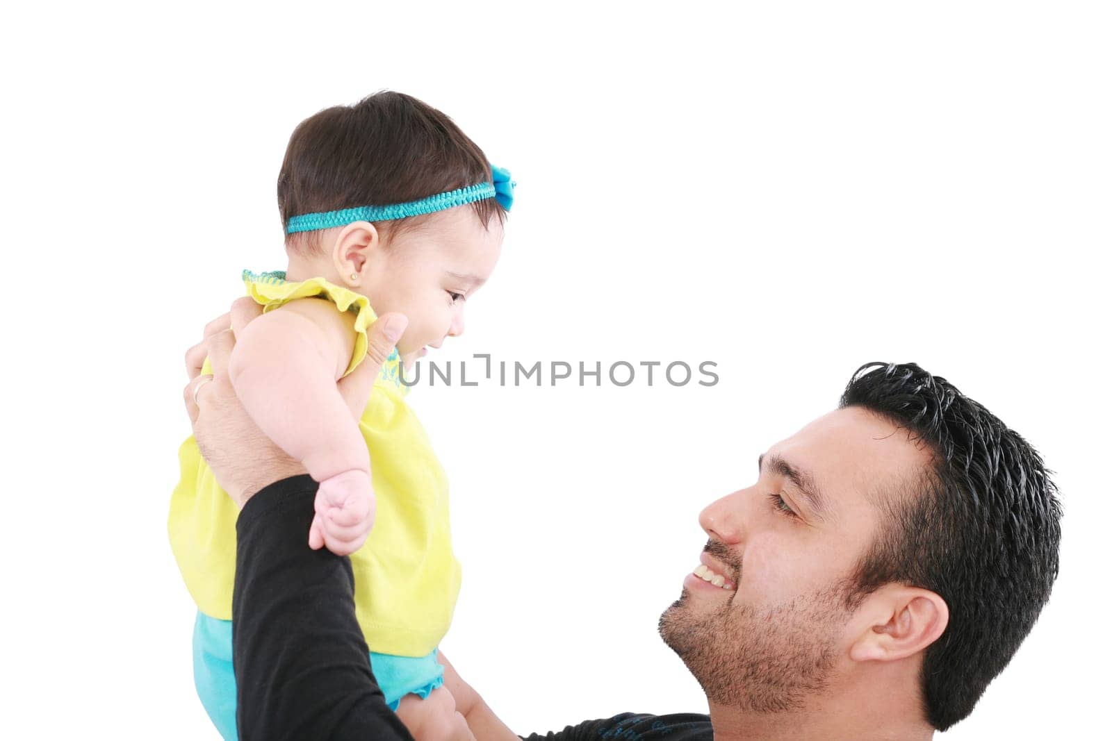 Baby and father are playing. The baby 8 month old. Isolated on a white background.