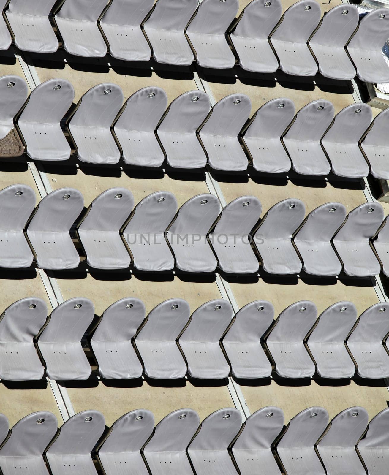 Rows of empty seats in an open-air theater - top view