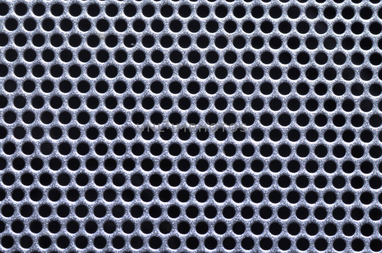 shiny silver metal pattern with reflective round holes