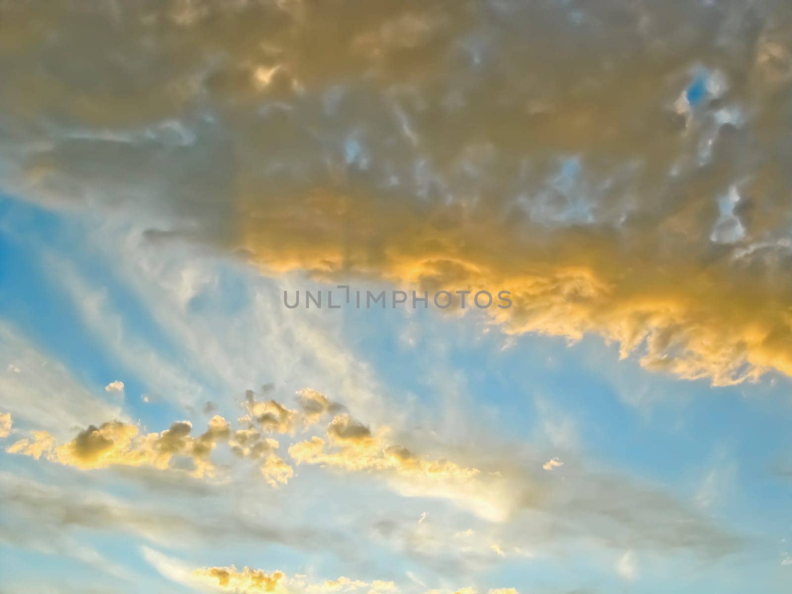 Clouds are illuminated by the setting sun