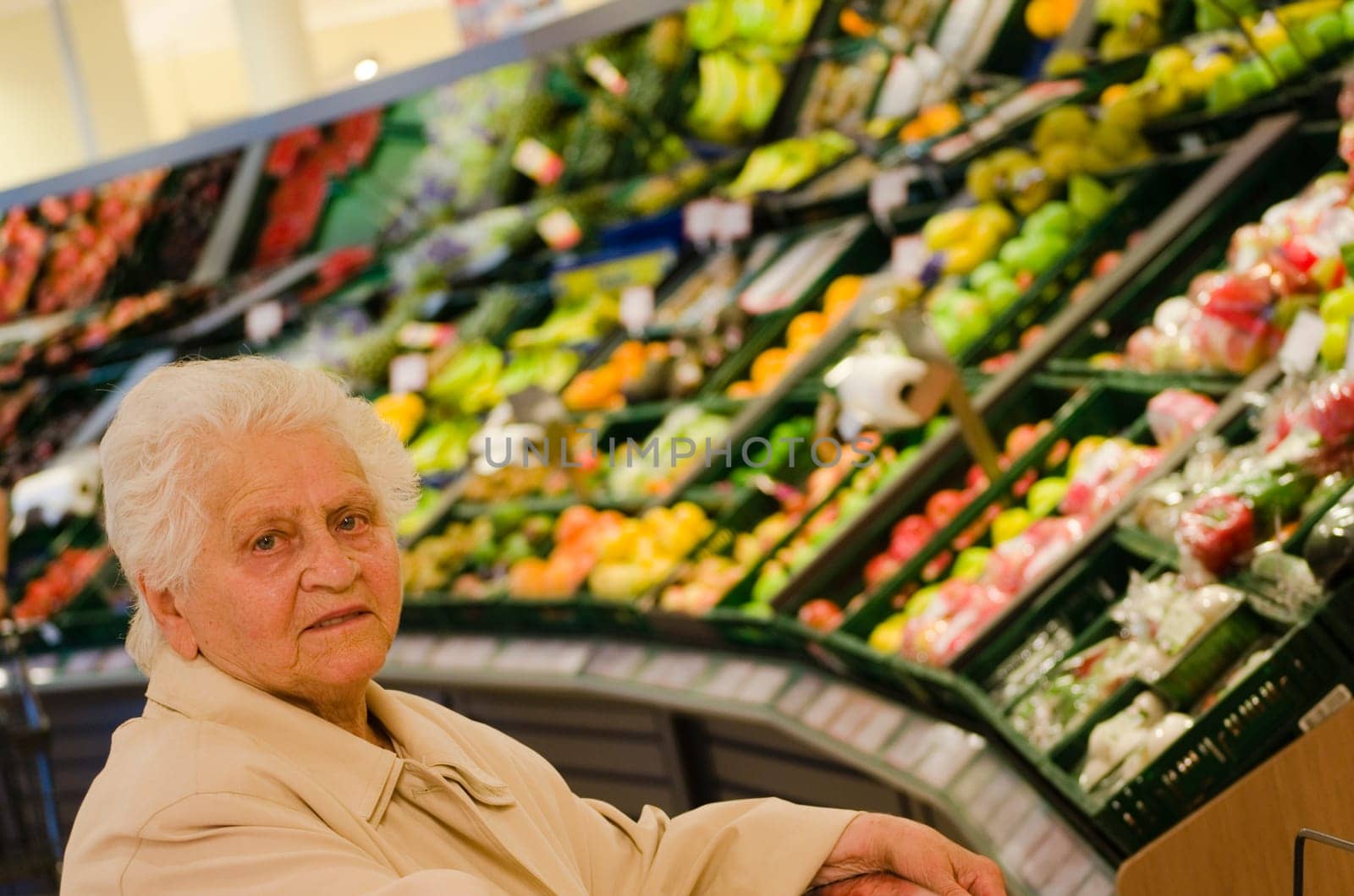 Senior woman shopping for groceries in supermarket