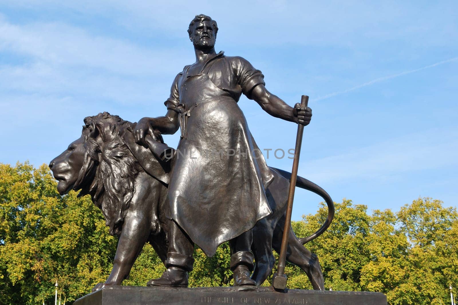 bronze statue with man and lion