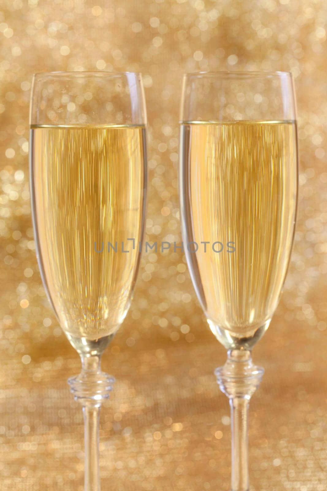 Champagne glasses with festive background