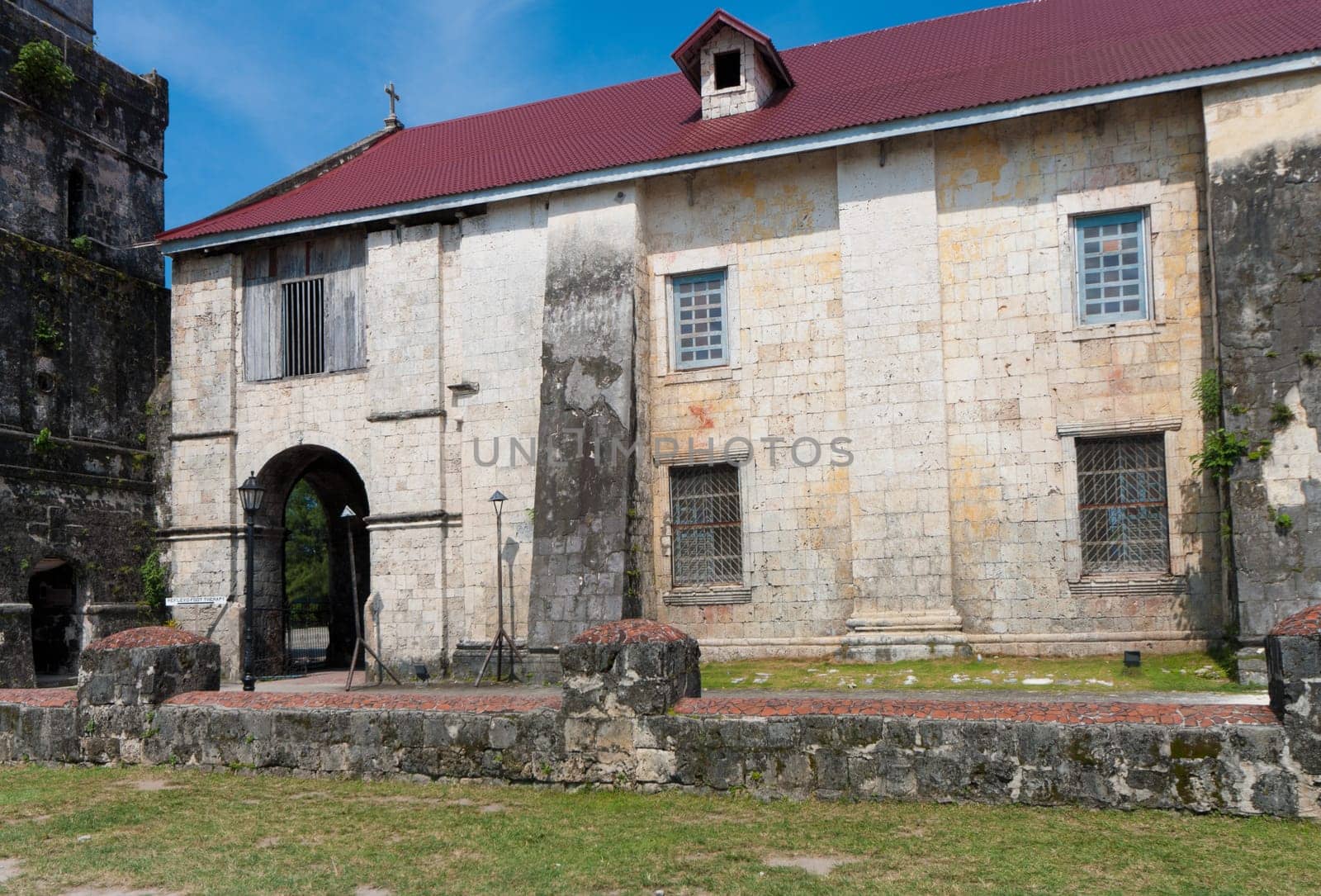exterior of the Baclayon church on Bohol, Philippines. You can see the face of St. Padre Pio on the wall.