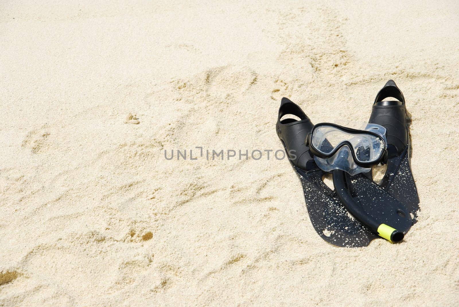beautiful sand background with snorkeling equipment