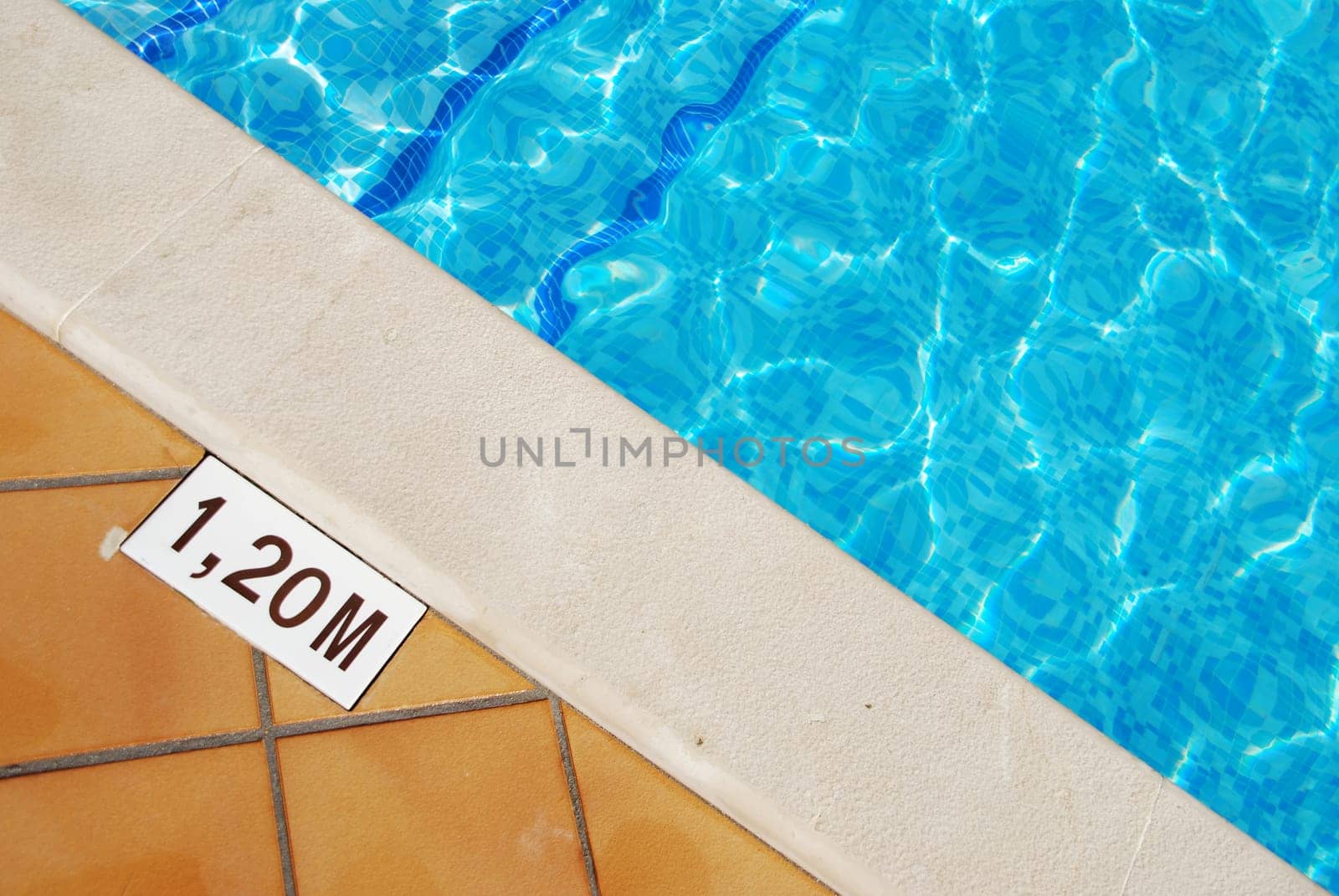 close-up photo of a 1.2m pool depth sign at the swimming pool